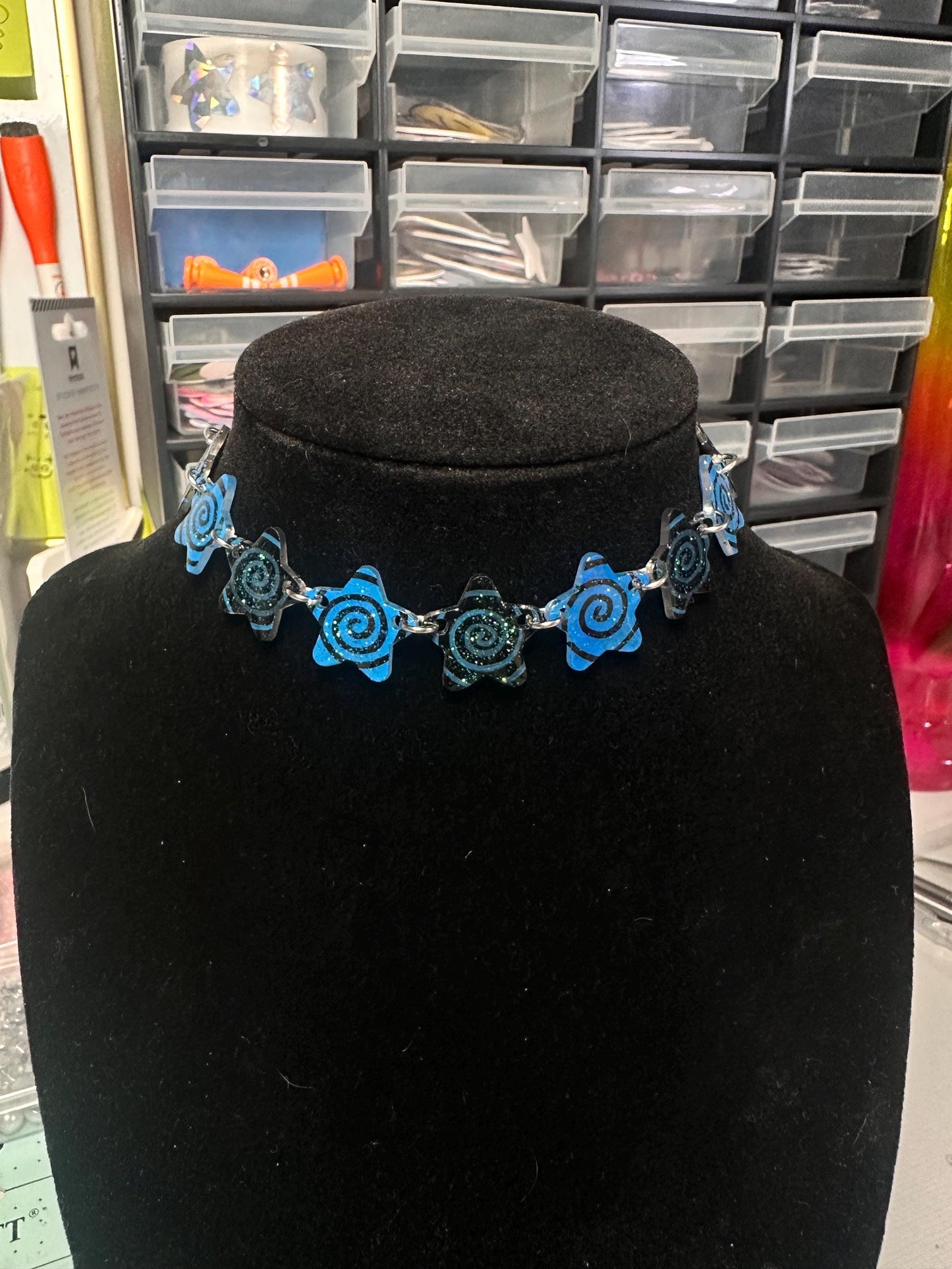 blue and black swirl star choker necklace