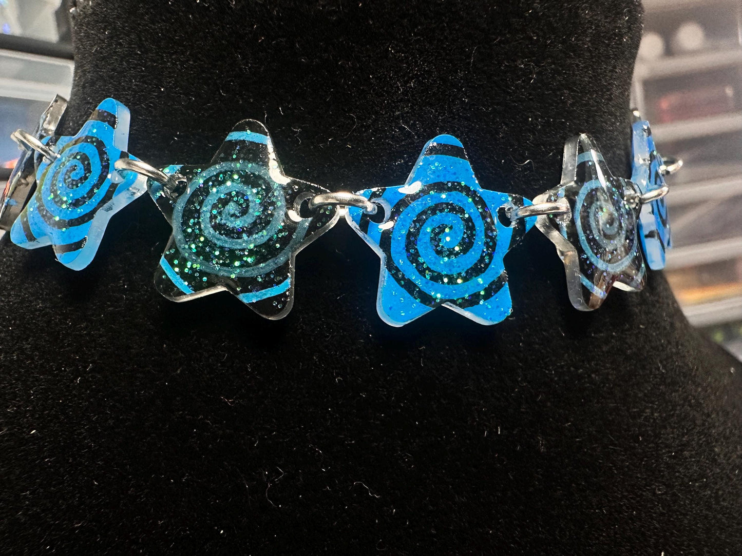 blue and black swirl star choker necklace