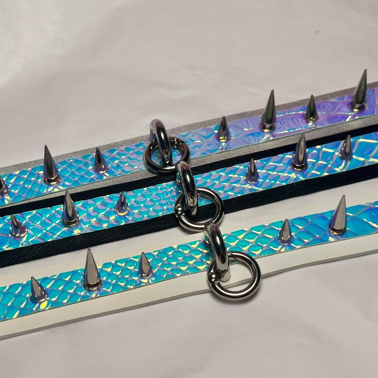 Iridescent spiked collar with silver ring and black band